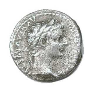 Roman coin with the head of the emperor Tiberius. The inscription may contain a claim of divinity.